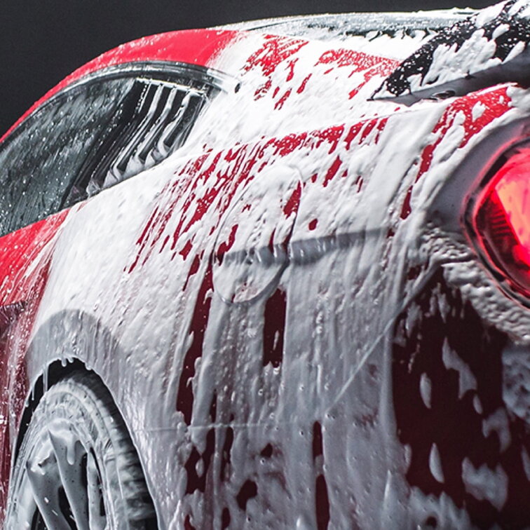 Conditioner foam covering a vehicle, preparing for a brilliant polish